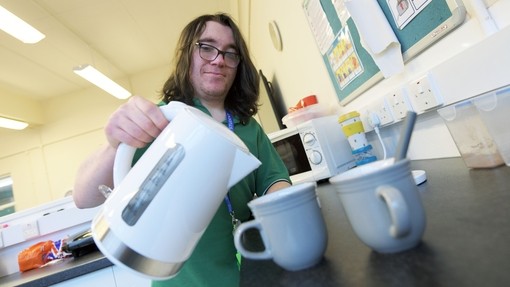 A student making a cup of tea.