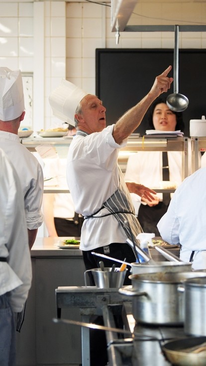 Student chefs in white uniforms