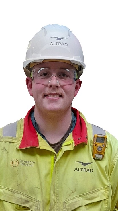 A headshot of Logan with hard hat and hi-vis