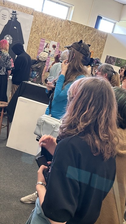 People looking at the exhibition in the private view 2025