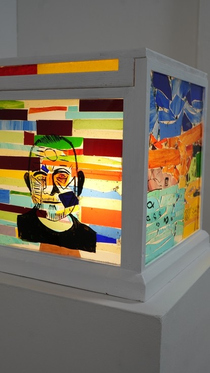 A light box shining through some bright colours in a box 