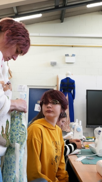 A resident graduate helping one of the students