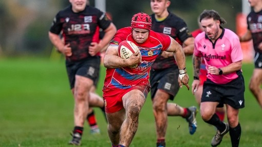 Student athletes playing rugby.