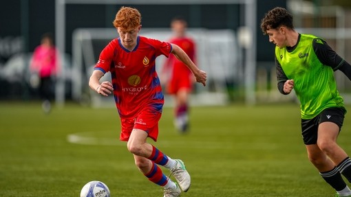 Student playing football.