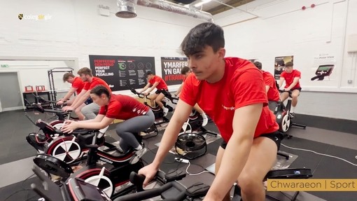 A student on an exercise bike.