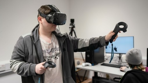 Student playing with a VR set.