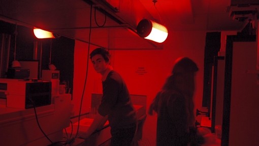 Students working in a dark room