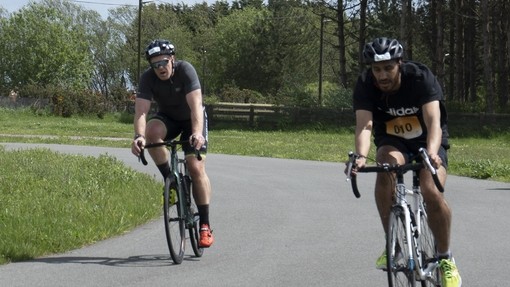 Two people cycling