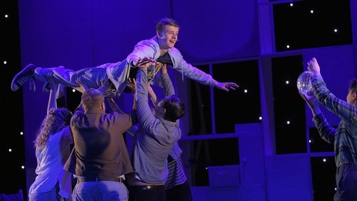 group of performing art students on stage