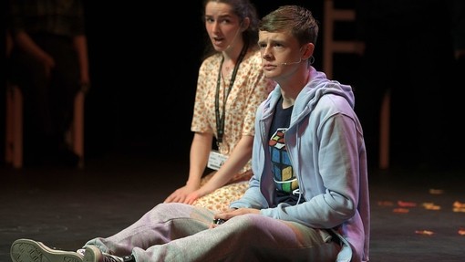 two performing art students on stage