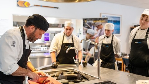 Lecturer teaching in a training kitchen