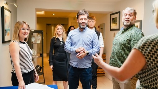 Group of students and parents registering at an event