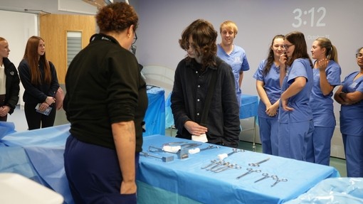 One of the students looking at the theatre medical instruments