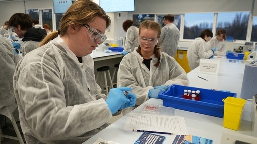 Two students working in a lab