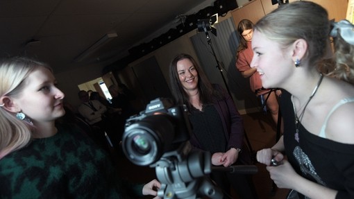 Two people talking with media camera in-between