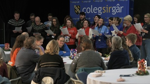 An audience watching the staff choir