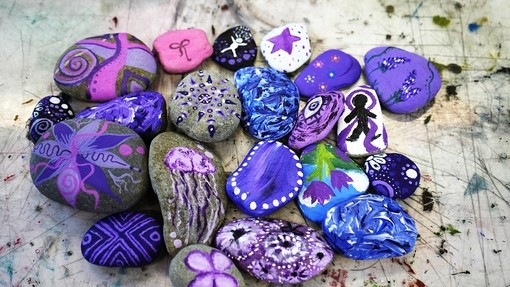 stones in ranges of purples that students have created for the day