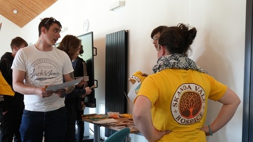 The students looking at Skanda Vale literature following Sister Ally's talk