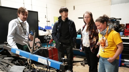 Sister Ally having a look around the workshop with a couple of students and Paul