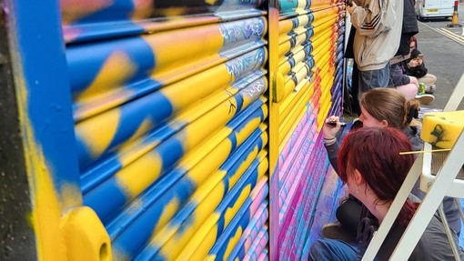 Students working on the outdoor shutters