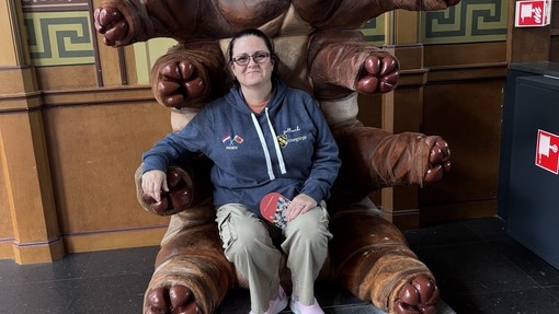 A learner sitting in a chair which is an oversized microbia