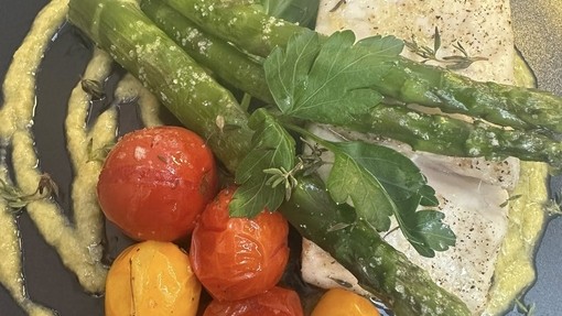 An example of an Italian dish someone ordered, very green and orange vegetable foods