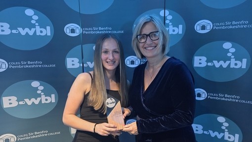Sophie with her award standing next to vice principal Vanessa