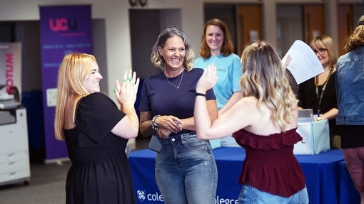 Students getting their Alevels with staff looking on happily