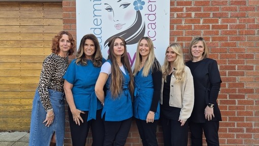 All the team stood outside lined up under the Academi Steil sign