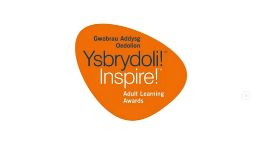 An orange shape with says in Welsh and English Inspire Adult Learning Award