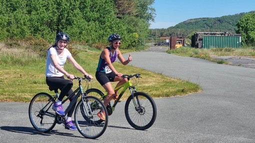 Hephzibah cycling with her daughter Rachel