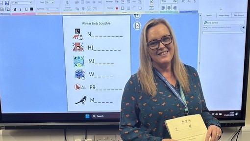 Val Morse standing in front of a screen (Elidyr staff member and former Coleg Sir Gar PGCE student)