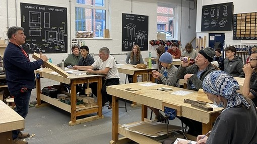 Students in the workshop at college listening to the maker talk