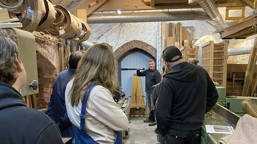 Students being shown around the maker's work area