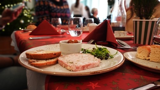 A starter dish of pate on a laid Christmas table