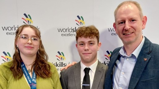 Ruby Webster, who studies at Cardigan campus won the bronze award for Restaurant Service pictured with a male and her lecturer Huw Morgan