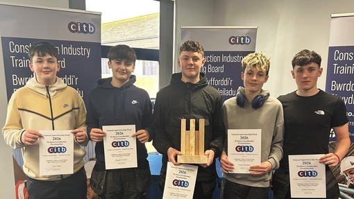 Five students in a line holding their CITB certificates