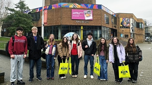 Students standing outside the university's Taliesin Theatre