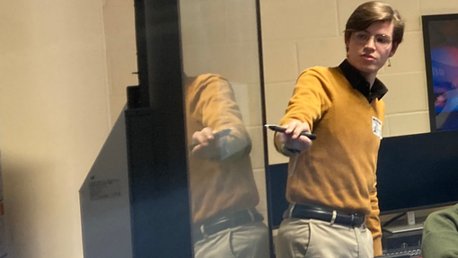 Ricardo pointing at the presentation 