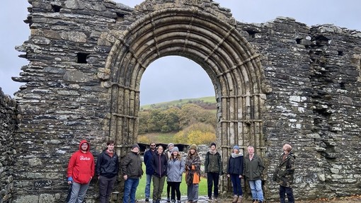 Students at the Abbey with the iconic archway