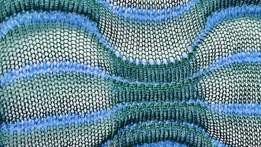 An array of blues and greens stringy weave design. Tegan James Double Bed Mercerised Cotton and Mohair