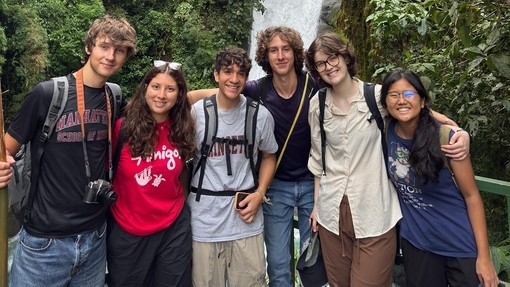 Hannah with her friends with a waterfall behind them