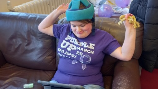 A student wearing a purple tee