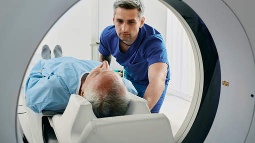 A radiographer putting someone through a treatment 