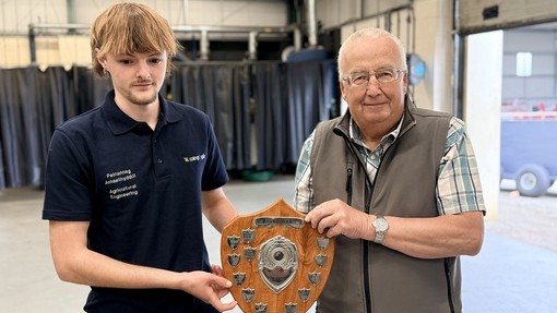 The winner receiving the John Hancock shield