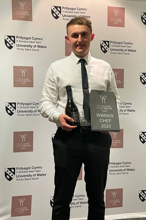 Sam Everton poses with an award