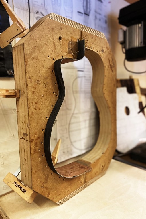 A technical cut-out of a guitar base