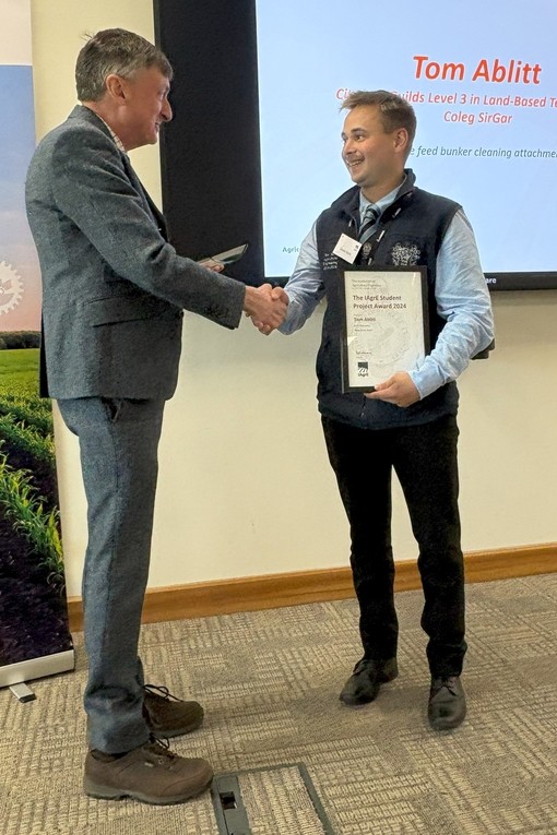 Tom being presented with his award
