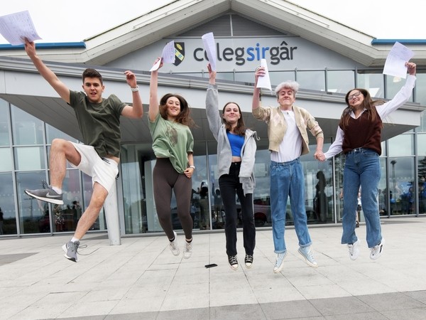 A group of students jumping in the air.