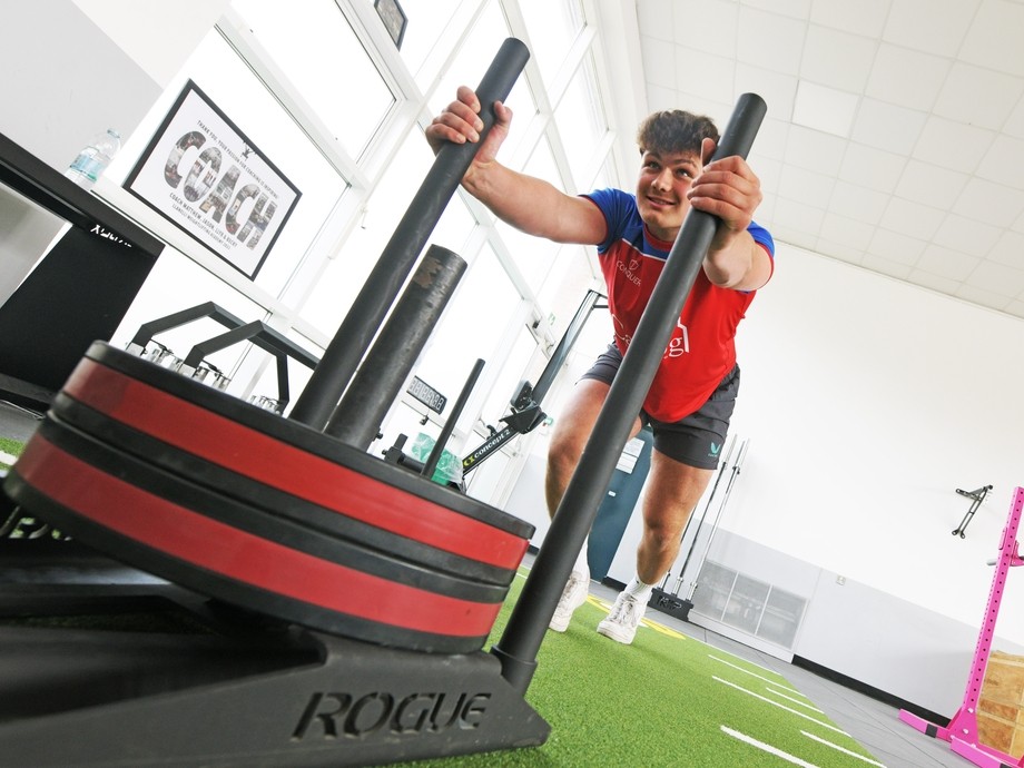 A student working out in the gym.